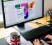 A person designing a colourful brochure in Microsoft Publisher 2024 on a laptop in a bright UK home office with papers, notepad, and a British flag mug.