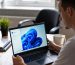 Laptop showing Activate Windows watermark on screen in modern home offic