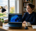 Laptop displaying a Windows 11 installation stuck during setup in a modern home office